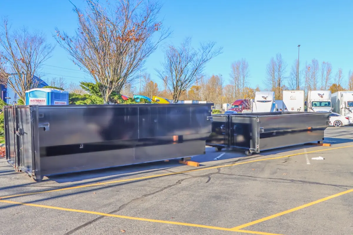 Professional dumpster rental service with roll-off container on residential driveway in Shorewood